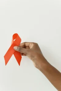 HIV Logo held up high.